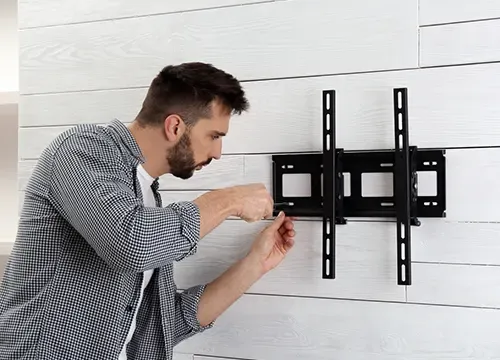 TV & Home Entertainment 1 Flat-screen TV mounted with a full-motion articulating wall mount.