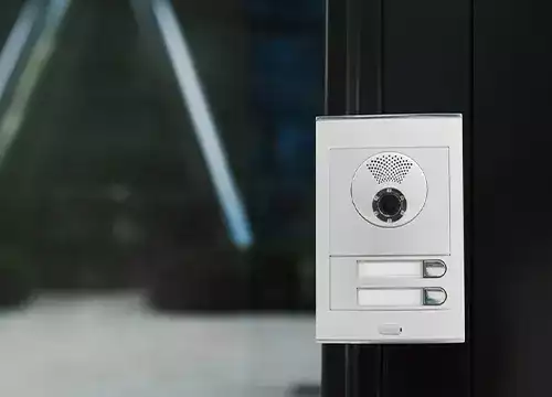 Access Control & Entry Solutions 4 Video intercom system being tested on a residential building wall.