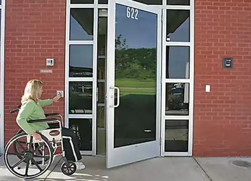 Access Control & Entry Solutions 3 Automatic handicap door opener being installed for accessibility compliance.
