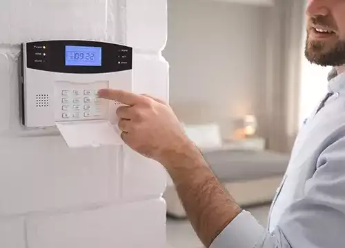 Alarm & Intrusion Systems 2 Comprehensive sensor kit including motion, glass-break, and smoke detectors being unpacked.